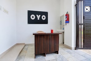 A reception desk with a sign that reads 'OYO' above it. - HOTEL O AAVYA INN (Lucknow)