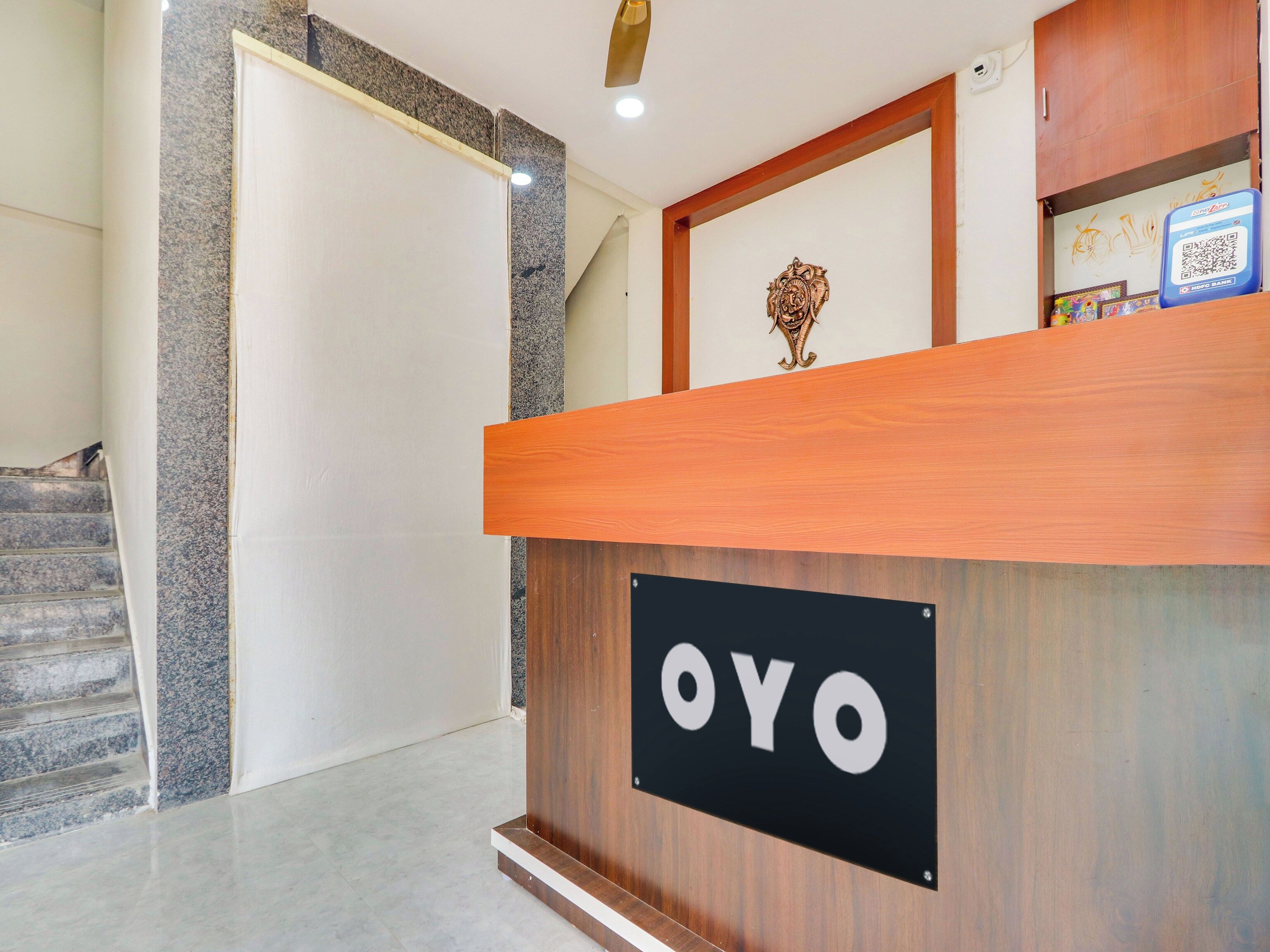 A reception desk with a sign that reads 'OYO'.