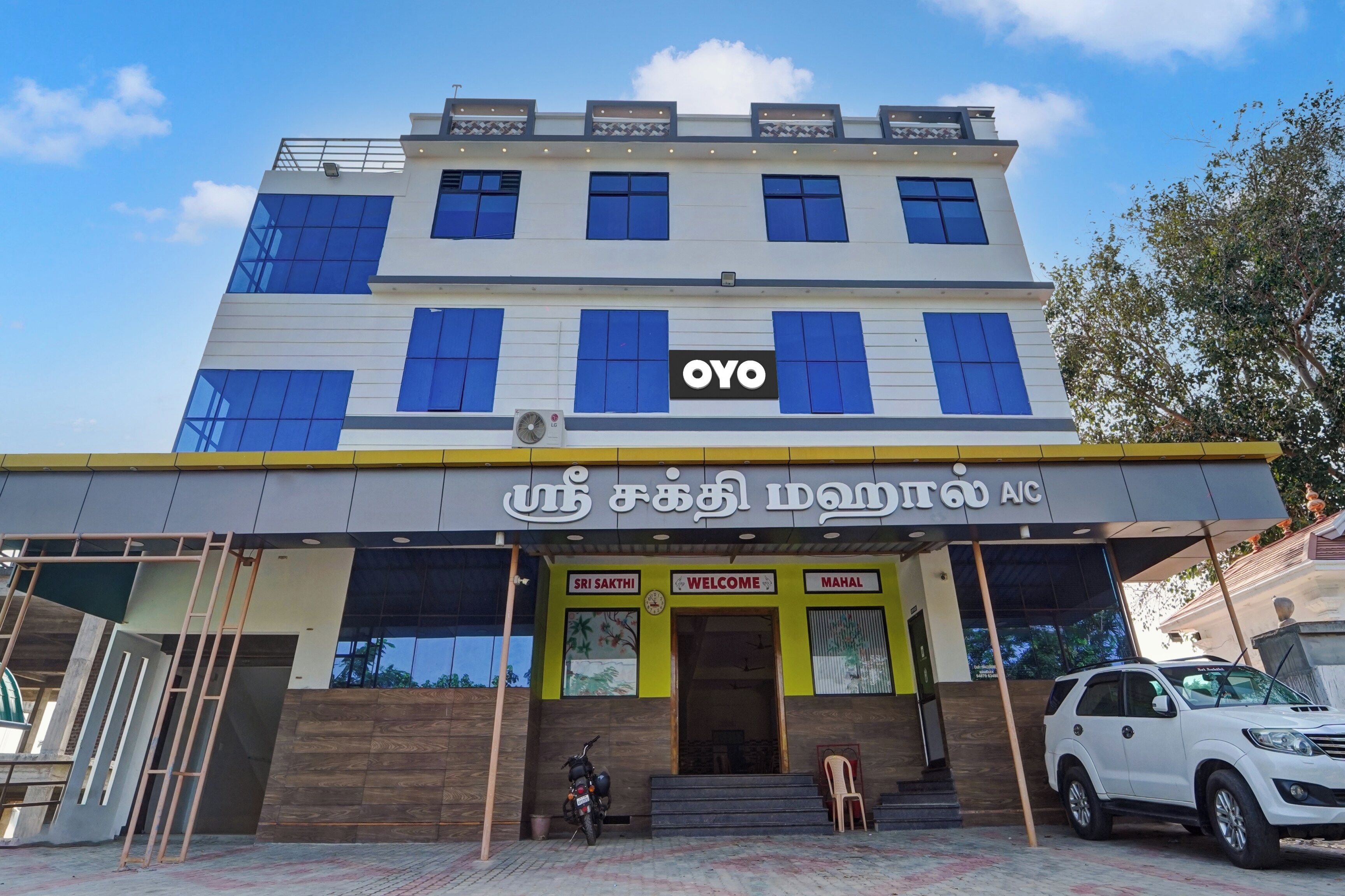 A multi-story building with a prominent 'OYO' sign on the facade.