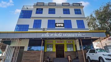 A multi-story building with a prominent 'OYO' sign on the facade.