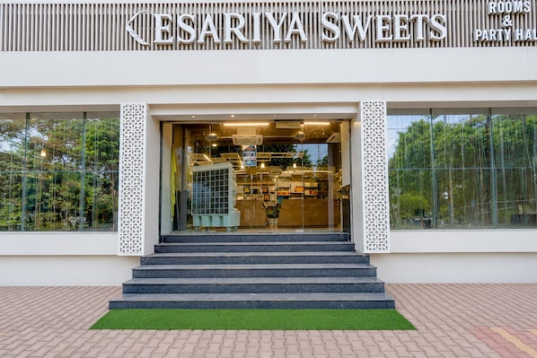 A storefront with a sign reading 'CESARIYA SWEETS' and 'ROOMS & PARTY HALL'. - Hotel O KEASARIYA SWEETS (Meerut)