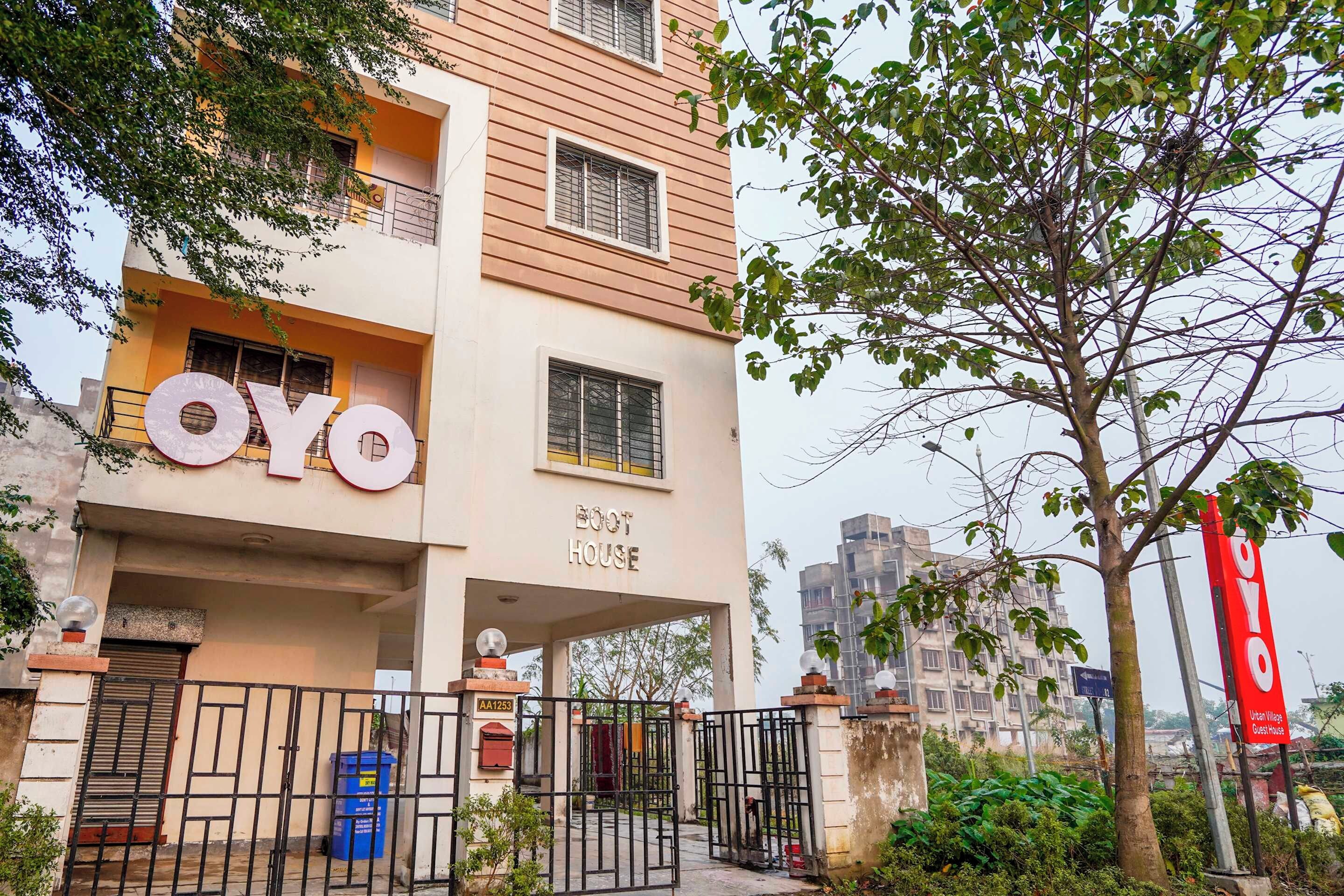 A building with the sign 'OYO BOOT HOUSE' indicating a guest house.