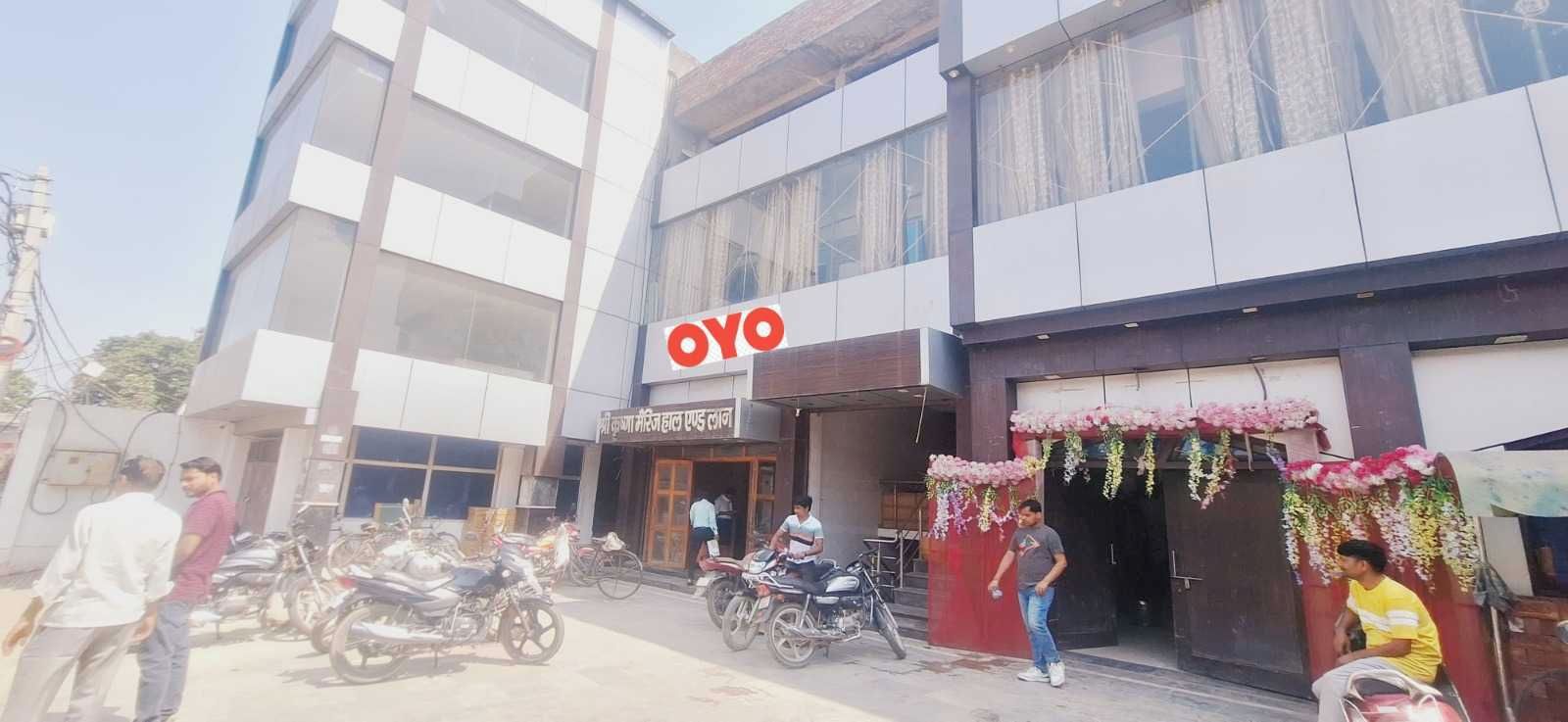 A building with a prominent 'OYO' sign, indicating a hotel or accommodation.