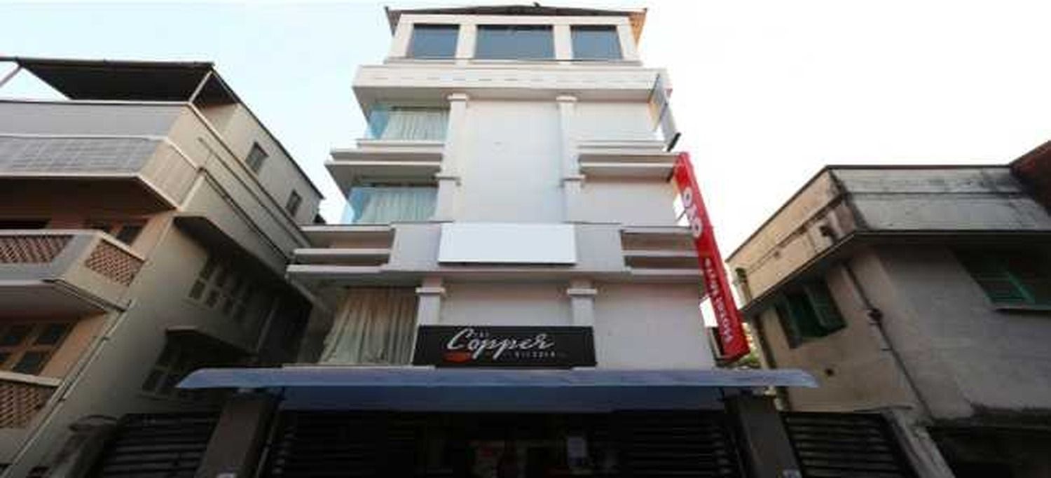 A multi-story building with a prominent sign for 'Coppice.'