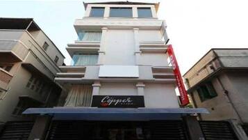 A multi-story building with a prominent sign for 'Coppice.'