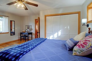 A bedroom with a bed, a desk, a chair, a wardrobe, and a ceiling fan. - Norfork Lake Cabin, 2 Mi to the Water (Calico Rock)
