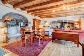 A rustic interior with a stone fireplace, wooden furniture, and a cozy seating area. - New Listing (Saint-Cirgues-de-Malbert)