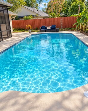 A rectangular swimming pool with clear blue water, surrounded by a concrete deck. - Private Pool Home - 12 Min to UCF - Sleeps 4 - Near Orlando Parks (Oviedo)
