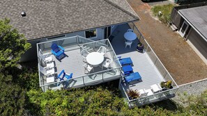 Back raised deck and side deck with outside dining area and multiple lounging areas - Large spacious home with 3 suites, views, large decks, steps to the beach (Manzanita)