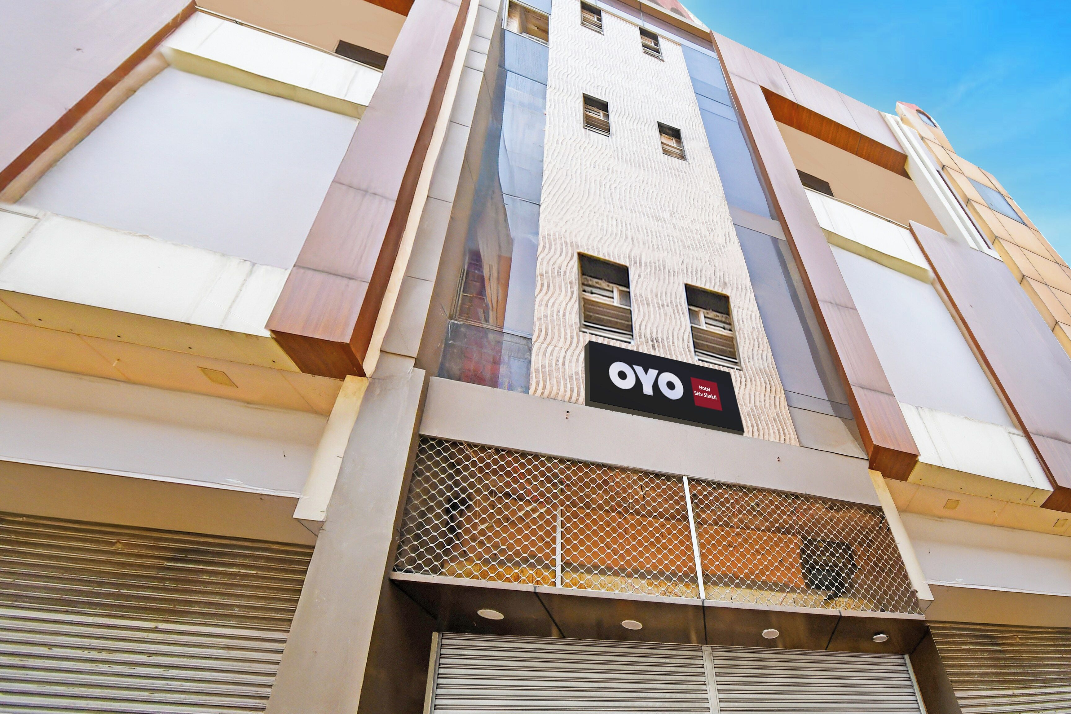 A hotel building with a prominent sign reading 'OYO Hotel Shily Shaka'.