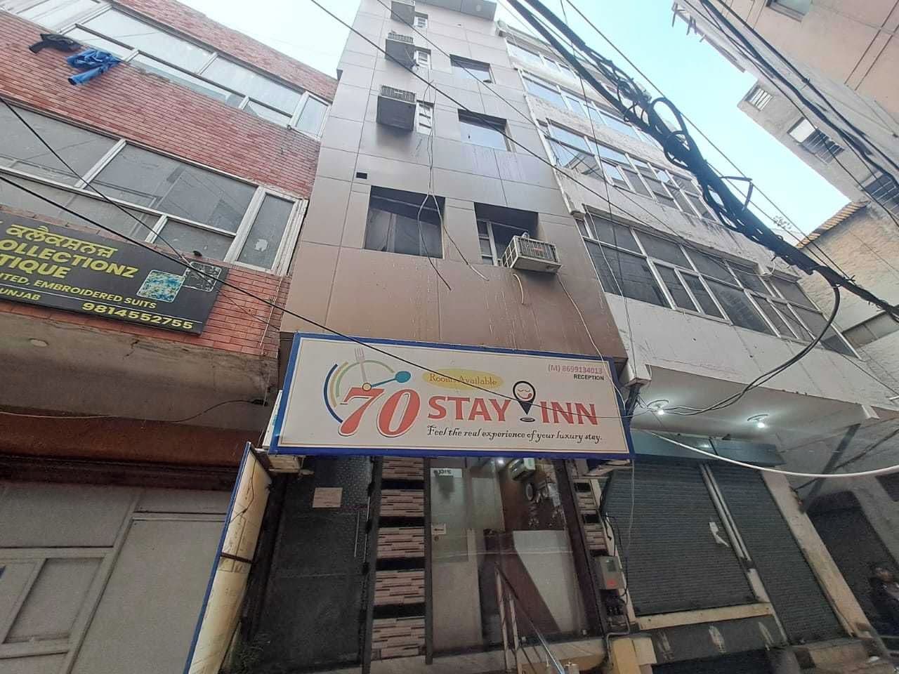 A multi-story building with a Stay Inn sign, indicating a hotel presence.