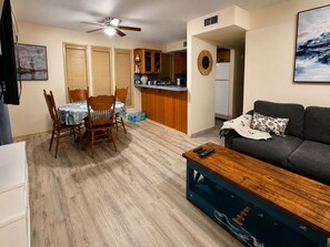 A compact living space with a dining area, kitchenette, and seating area. - Waterfront Port Isabel/South Padre Condo for long term rent!! Sleeps 6 (Port Isabel)