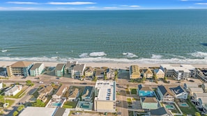 A coastal residential area with a beachfront, houses, and a road leading to the beach. - 108 Latitude Adjustment (Murrells Inlet)