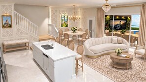 A modern living room with a sofa, coffee table, and dining area. - Enchanted 5 BD/ 4.5 BA/ Windsor Cay - 16262 CC (Clermont)
