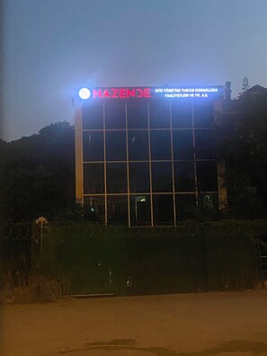 A building with a sign that reads 'NAZENDE' and additional text in a foreign language. - KADIKÖY MERKEZDE (İstanbul)