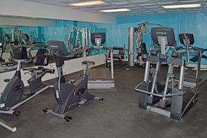 A gym with multiple exercise machines, including treadmills and elliptical trainers. - Sea Watch Oceanfront Escape | Balcony Views, King Bed, Pools & Lazy Rivers (Myrtle Beach)