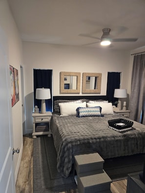A bedroom with a bed, two nightstands, a ceiling fan, and a window with curtains. - Pine & Starlight Retreat Steps from State Forest - New Build - Clean & Stunning (Heber-Overgaard)