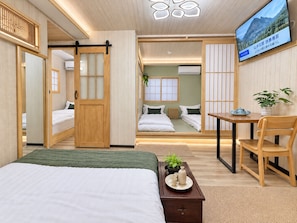 A modern hotel room with a bed, a desk, and a television. - TOKYO MOON HOUSE - Skytree Rooftop (Sumida City)