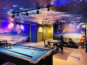 A room with a pool table, a billiards table, and a space-themed mural. - 16Pax Sunway Pyramid Karaoke Homestay by 4Balance (Petaling Jaya)