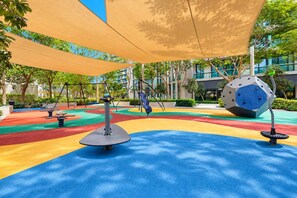 A playground with colorful play areas and exercise equipment. - FIRST CLASS | 1BR | Walk to Burj & Dubai Mall (Downtown)