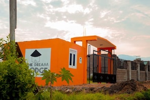 A gated entrance with a sign reading 'The Dream Lodge.'