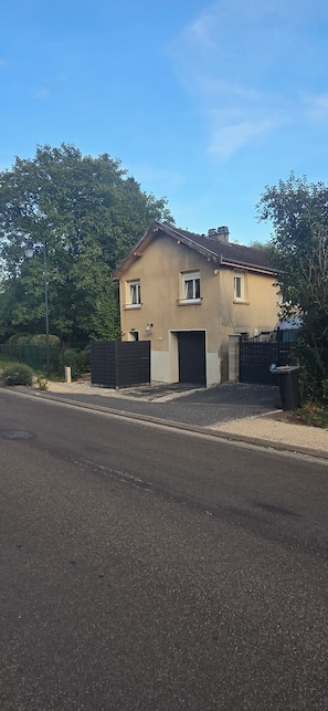 A two-story house with a garage, a paved driveway, and a street lamp. - New Listing (Ville-sur-Saulx)