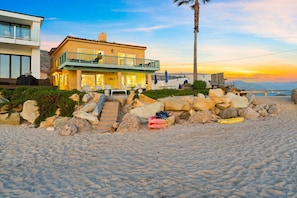 A beachfront property with a two-story building, a balcony, and a view of the ocean. - Toes On The Sand, Perfect 4 Families, Amazing View (Ventura)