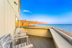 A wooden deck with a view of the sea and mountains. - Oceanfront Retreat, Amazing Ocean Views W/Jacuzzi! (Ventura)