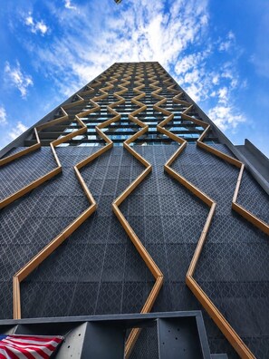 A modern building with a geometric facade and a clear sky. - Scarletz KLCC By Solvane Hospitality  (Kuala Lumpur)