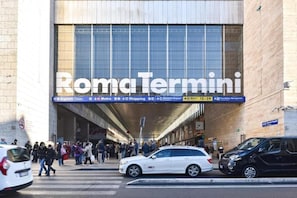 A train station entrance with a large sign reading 'Roma Termini'. - RELAX Palace (Roma)