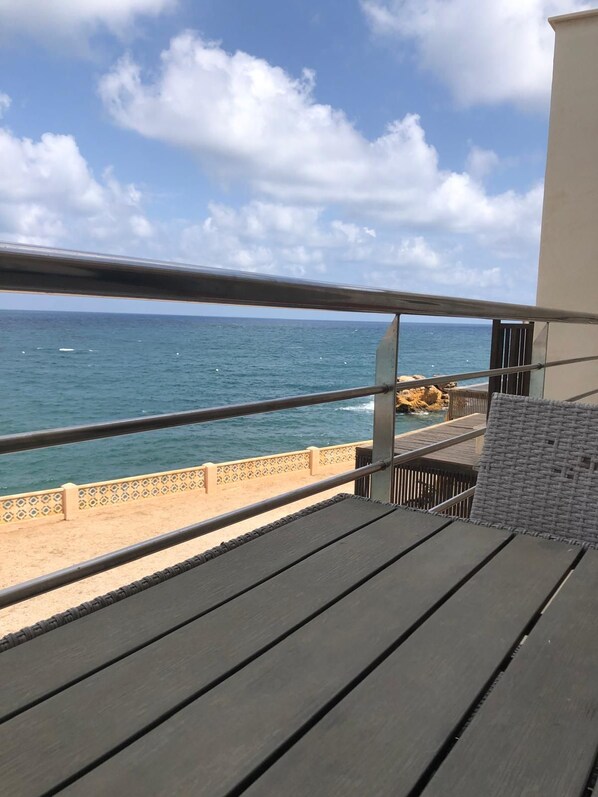 A balcony with a view of the ocean, a sandy beach, and a rocky outcrop. - New Listing (Cabo de Palos)
