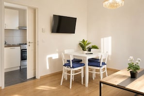A modern kitchen with white cabinets and a built-in oven. - Vienna Days and Cozy Nights 1BR with Lounge near Westbahnhof (Vienna)