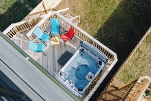 A hot tub on a wooden deck with outdoor furniture. - Charlotte Retreat - Hot Tub, Games & Near Uptown (Charlotte)