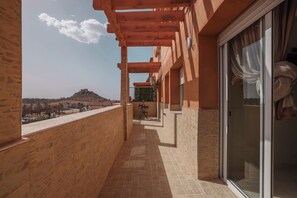 A balcony with a view of a hill and buildings in the distance. - Marrakech 2 Bedroom 2 Bathroom Luxury Apartment,Large Balconies and Free Parking (Marrakech)