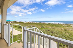 A balcony with a view of a beach and ocean. - 55 S Atlantic Ave 4-20 (Cocoa Beach)