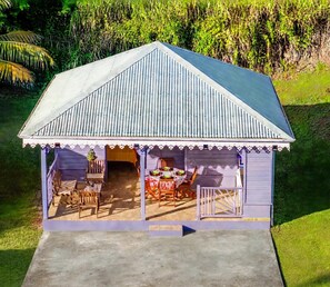 A small, single-story building with a gabled roof and a covered porch area. - New Listing (Saint-Pierre)