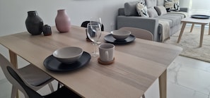 A dining table with bowls, a wine glass, and vases. - Lagoons Village Tm Torrevieja (Torrevieja)