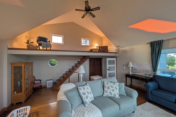 Spacious loft-style living room with vaulted ceilings and cozy seating