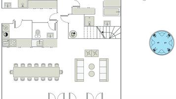 Plano de planta de un hotel que muestra varias habitaciones, un comedor y una zona de estar circular.