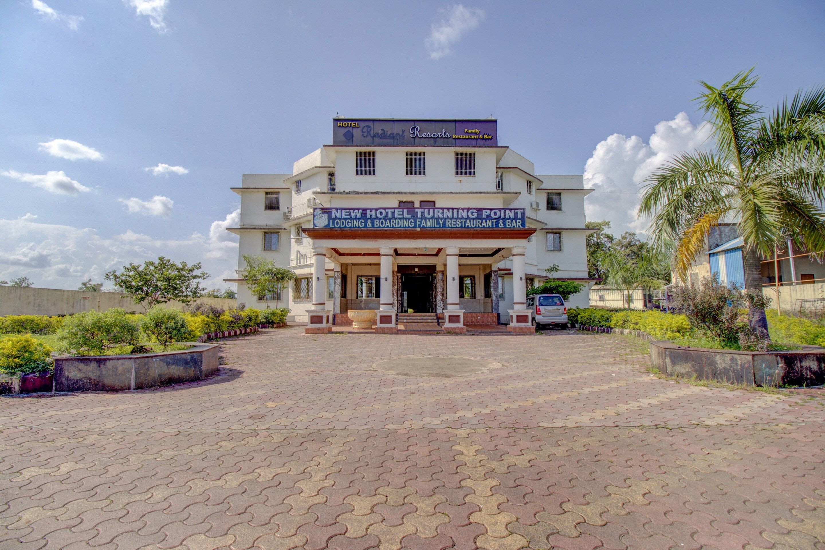 A hotel with a signboard indicating it is a family restaurant and bar.