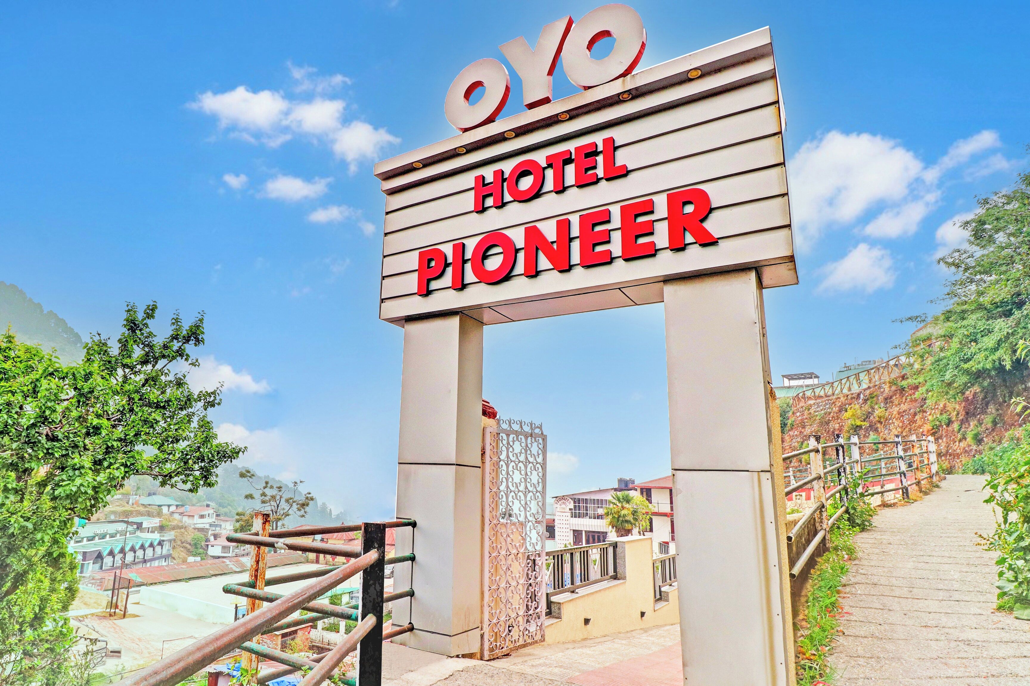 A hotel sign with the name 'OYO PIONEER' indicating the hotel's branding.