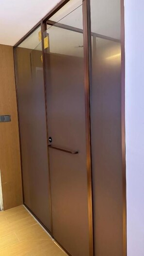 A sliding door with a metallic handle and a glass panel. - diver's home resort (Panglao)