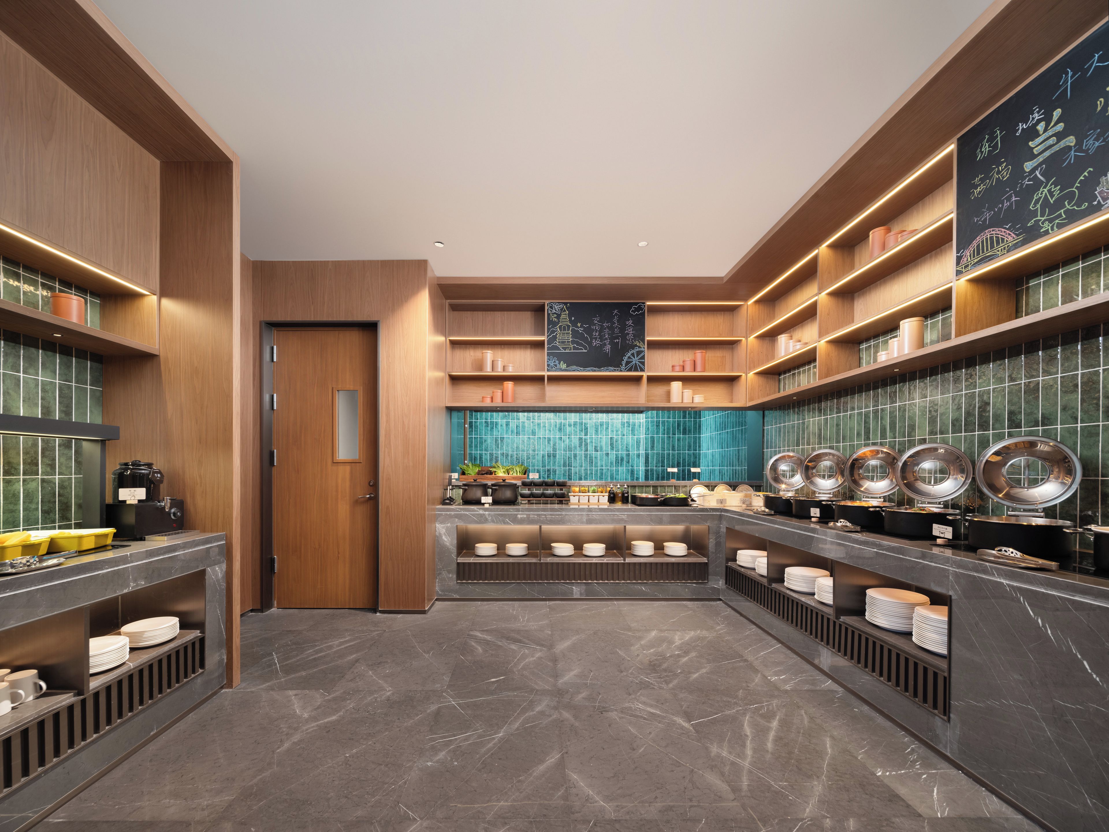 A modern kitchen with wooden cabinetry, a central island, and a blue-tiled backsplash.