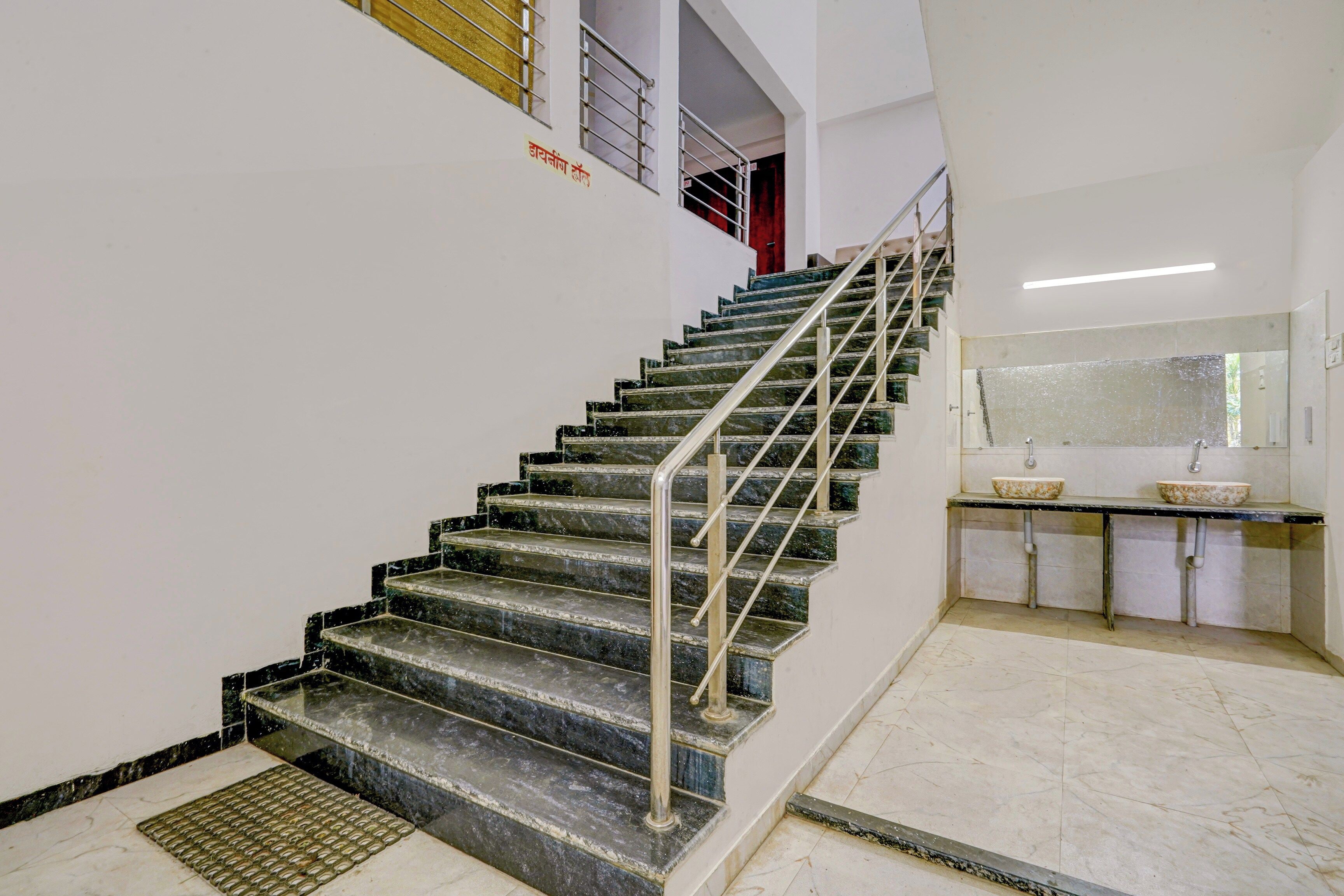 A staircase with metal railings leading to an upper floor.