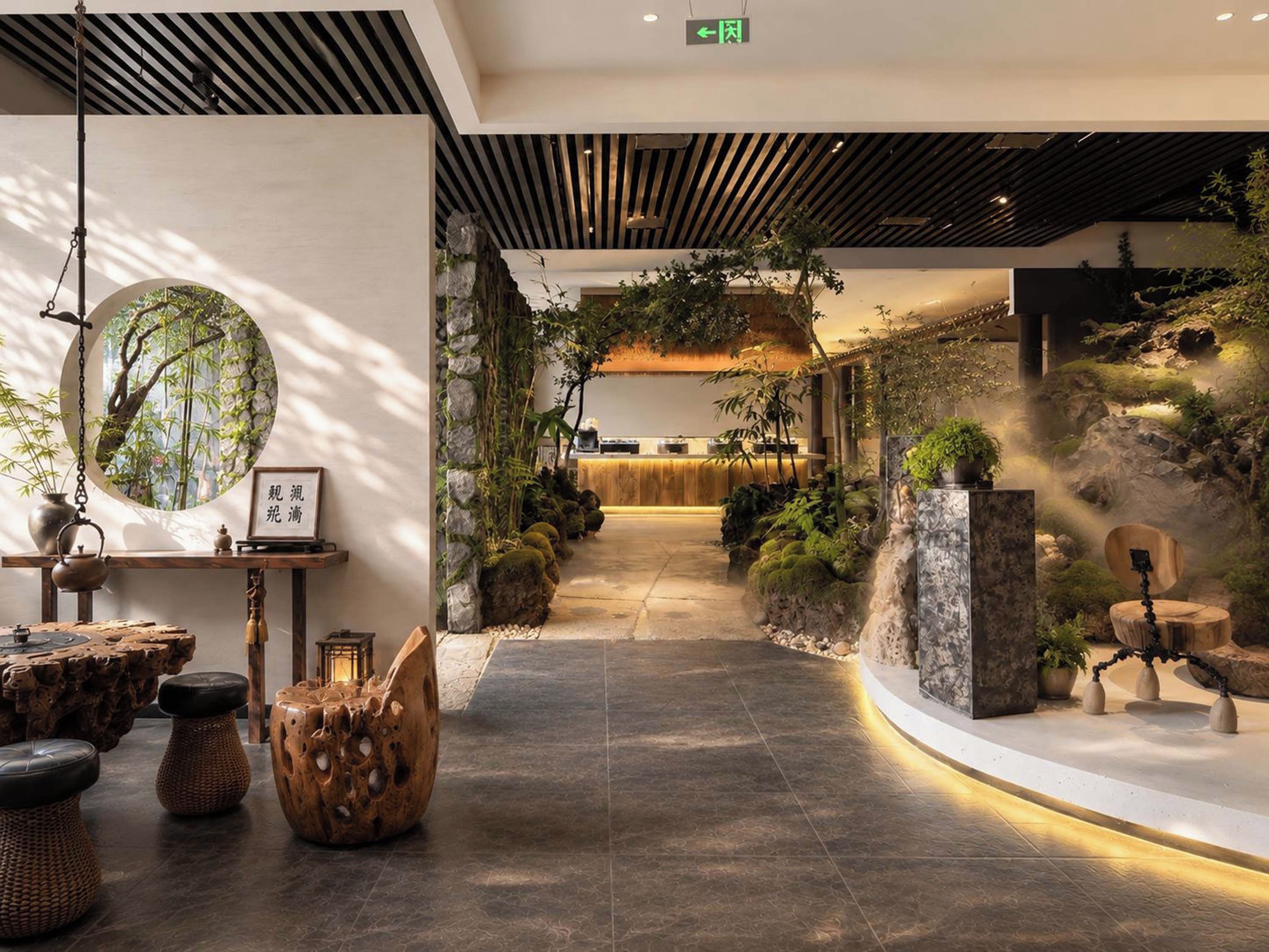 A modern interior with a central pathway, wooden furniture, and indoor plants.