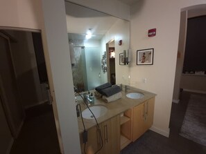 A bathroom with two sinks, a mirror, and a towel rack. - Waterfront location for rent with great quick escape! (North Tonawanda)