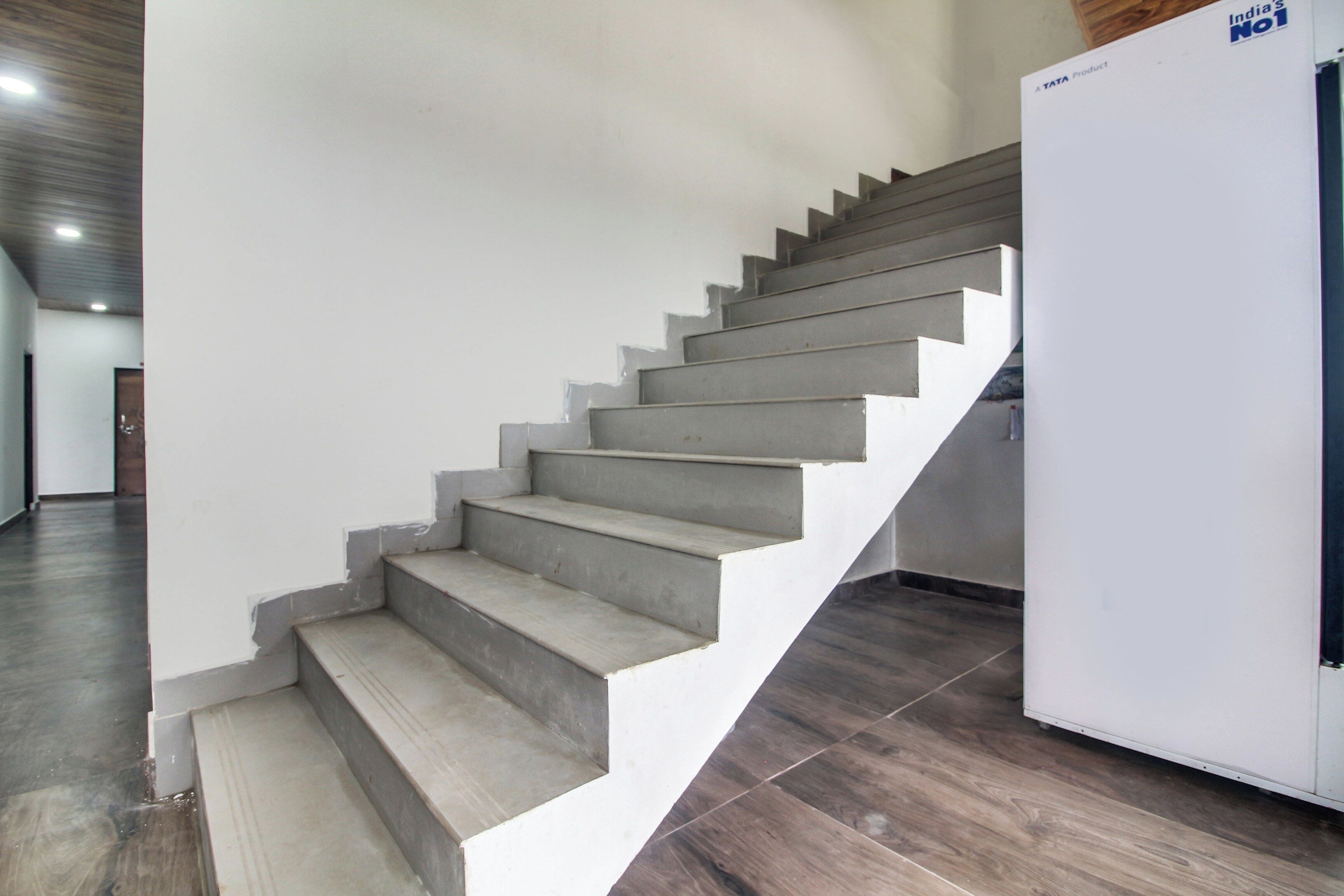 A staircase with a modern design, leading to a landing.