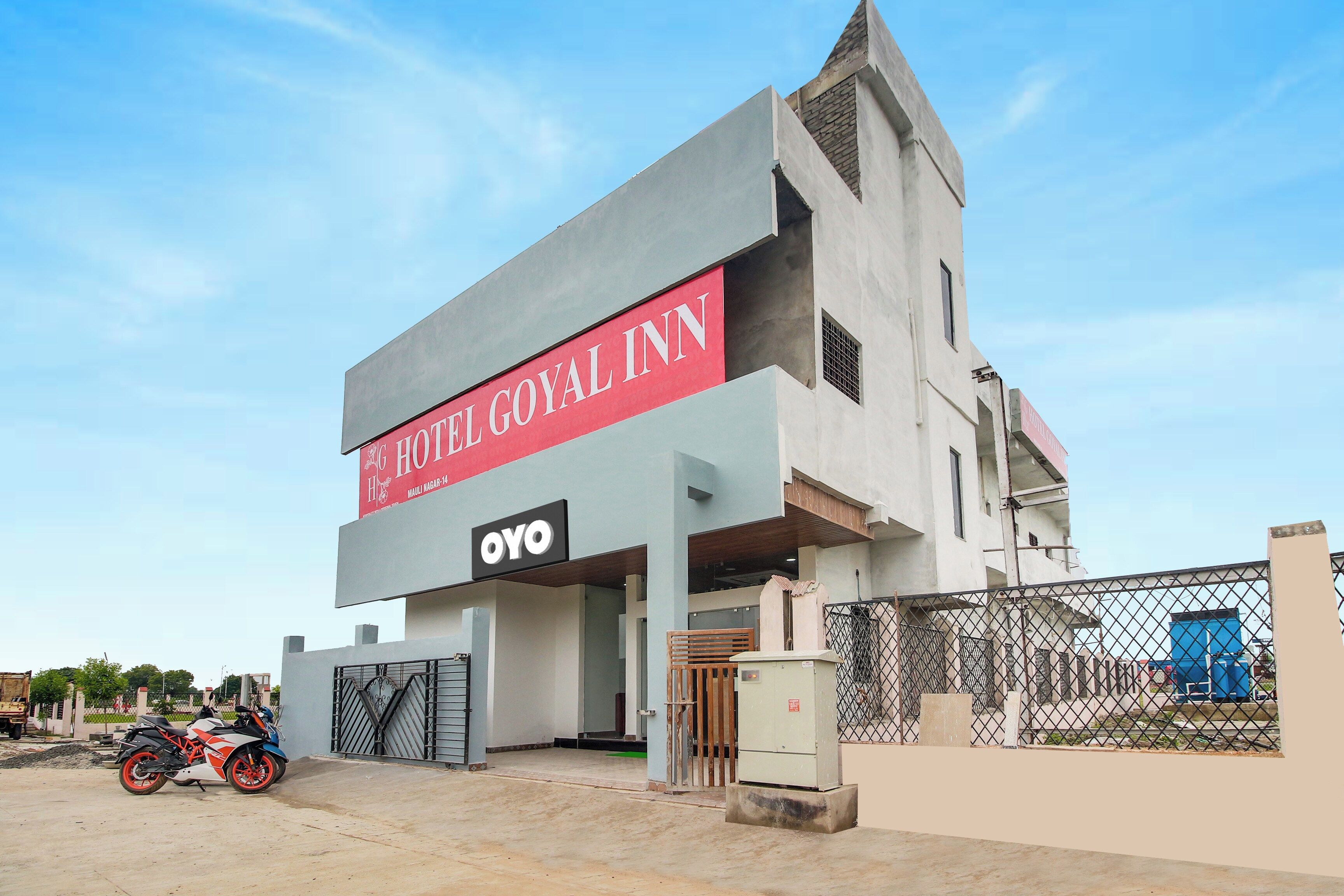 A modern hotel with a prominent sign for 'HOTEL GOYAL INN' and a logo for 'OYO'.