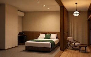 A hotel room with a bed, bedside table, chair, and a hanging light fixture. - SANDANKYO HOTEL NAMPO (Akiōta)