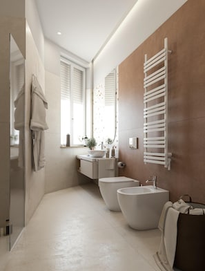 A modern bathroom with a large mirror, two sinks, a toilet, and a towel rack. - MAIN Exclusive Apartments - Toledo (Napoli)